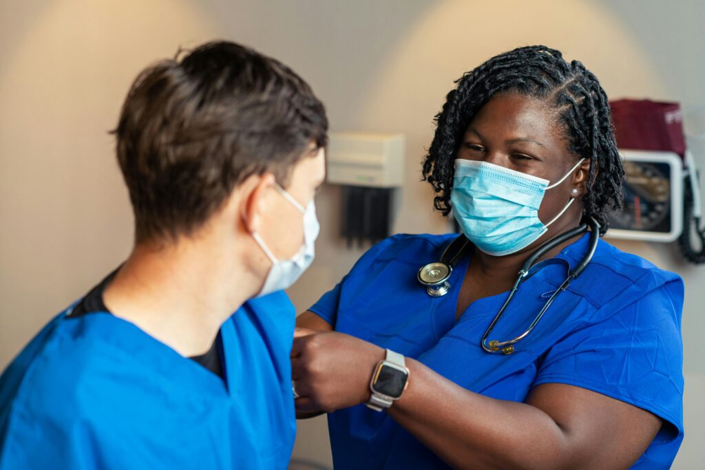 A nurse places a bandage after administering a shot. 20 million Americans face the possible loss of their health coverage because of a Republican plan to reduce federal support for Medicaid.