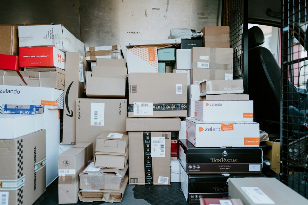 Parcels stacked in the back of a delivery van. CEOs of major retailers warn that Trump's steep tariffs could raise prices for American consumers,